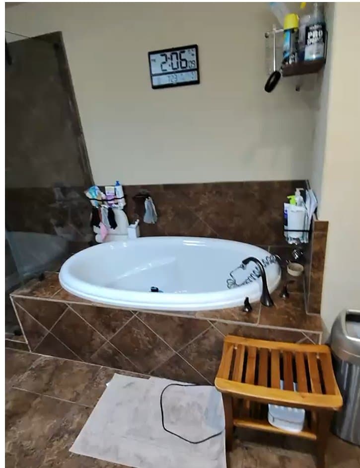 Sonoma Ranch garden tub before the rebuild — original tile deck with failing grout joints
