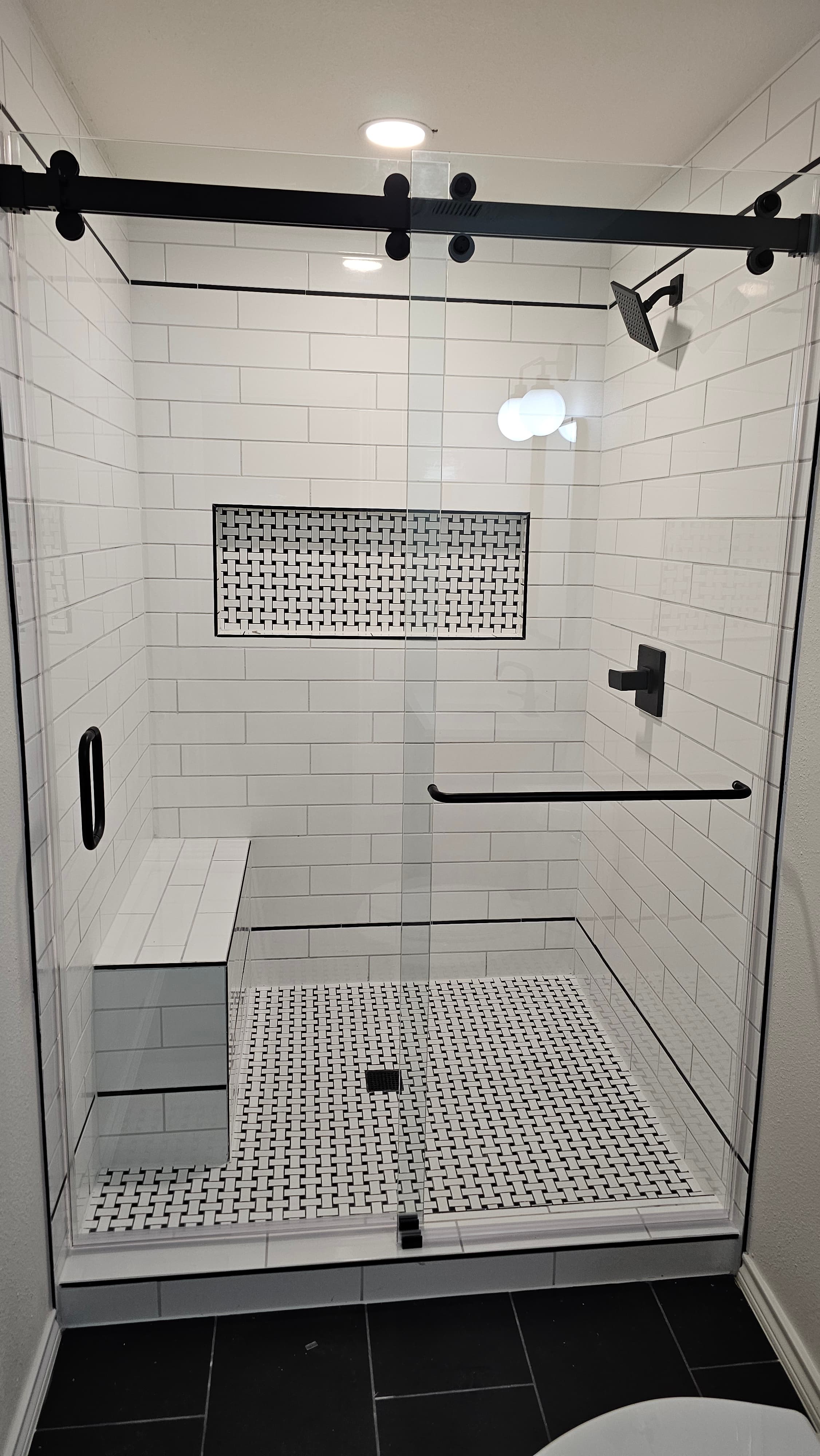 Helotes custom tile shower — floor-to-ceiling porcelain with niche